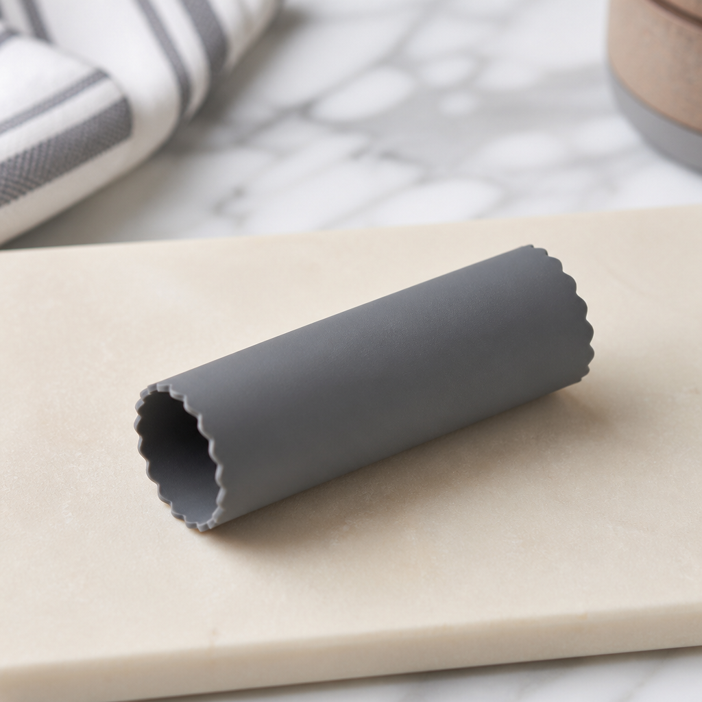 A silicone garlic peeler